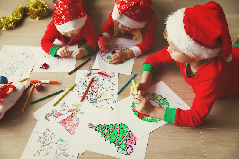 Kids in santa hats coloring